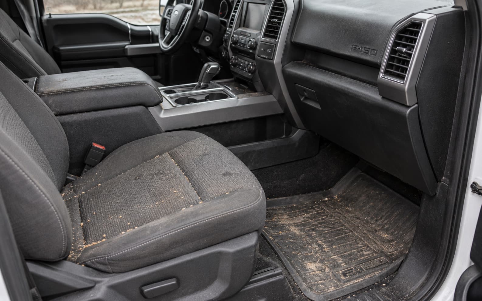Ford F-150: Crumbs and dirt on the seat and floor mat
